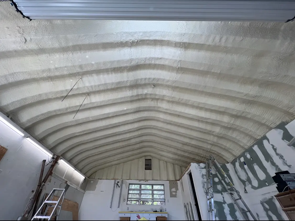 Spray polyurethane foam applied to the underside of a metal roof deck in North Miami